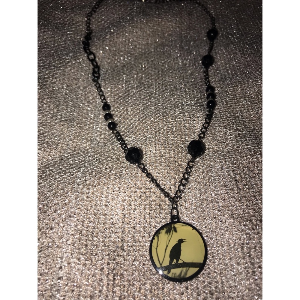 Raven pendant necklace.